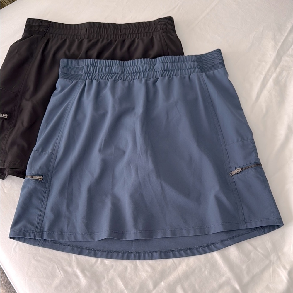 Blue and Black Athletic Skorts with Zippered Pockets.